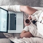 Young woman writing on laptop sexy