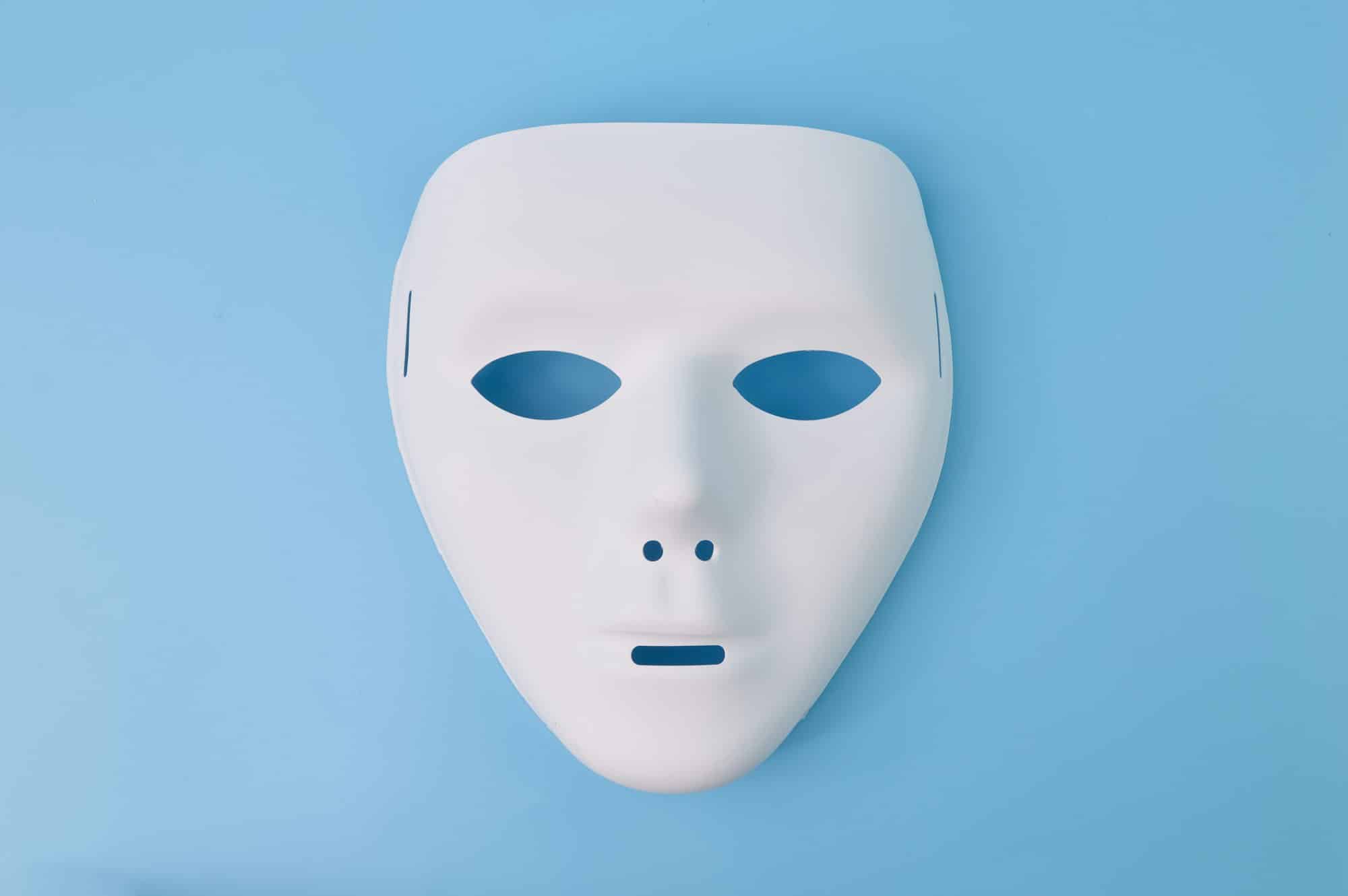 Anonymous mask isolated on a blue background