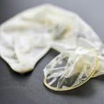 Used condom on table